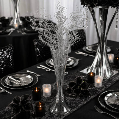 Silver sparkle curly ting stems in a glass vase on a formal black table setting - thumbnail number 7