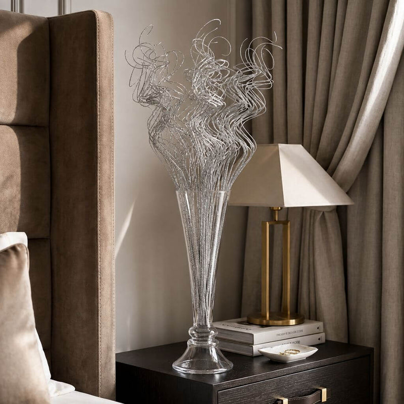 Silver sparkle curly ting stems in a glass vase on a nightstand - thumbnail number 11