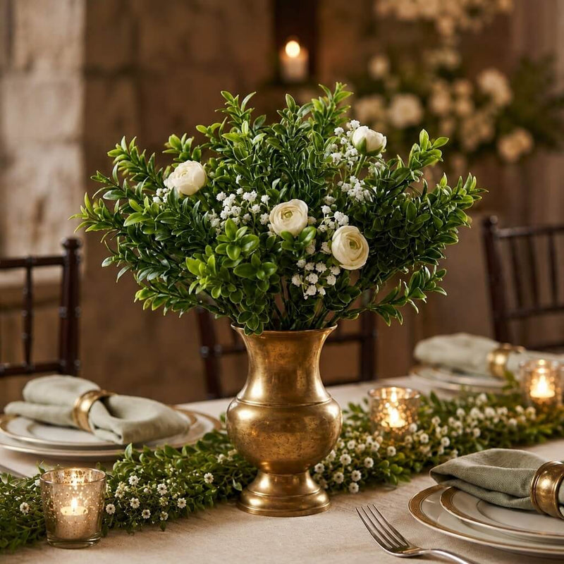 Green boxwood sprays with white flowers in a brass vase - thumbnail number 5
