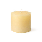 Small textured ivory candle with a single central wick against white - thumbnail number 3