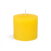 An unlit Yellow unscented votive candle isolated on a solid white background - thumbnail number 3
