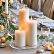 8" Round Glass Pillar Plate with three lit pillar candles on a gray tablescape - thumbnail number 4