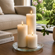 8" Round Glass Pillar Plate with three lit pillar candles on a coffee table - thumbnail number 8