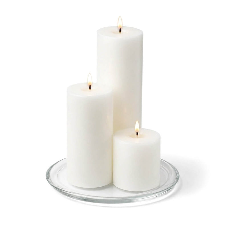 8" Round Glass Pillar Plate with three lit pillar candles on a white background - thumbnail number 3