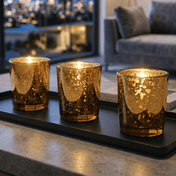 Three lit Amber Gold Mercury Votive Holders placed on a black tray inside a modern room - thumbnail number 7