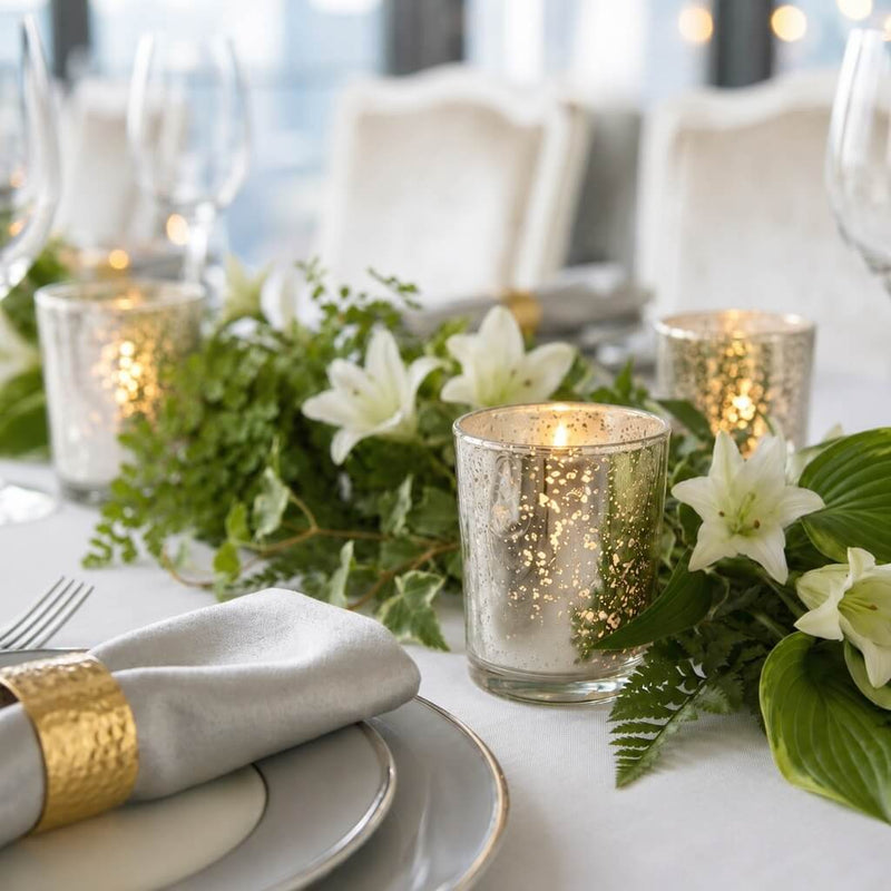 Silver Mercury Votive Holders with lit candles on a white tablescape with white lilies - thumbnail number 5