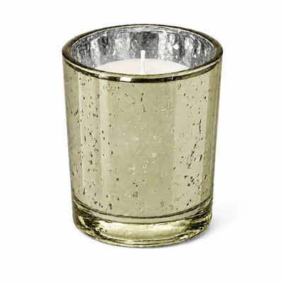 An upscale dining table setup showcasing a burning Metallic Gold Mercury Votive Holder cup - thumbnail number 2