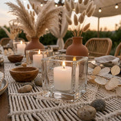Glowing candles in glass holders on boho outdoor table with pampas grass decor - thumbnail number 4