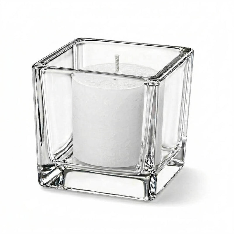 Unlit white candle in clear square glass holder on white background - thumbnail number 2
