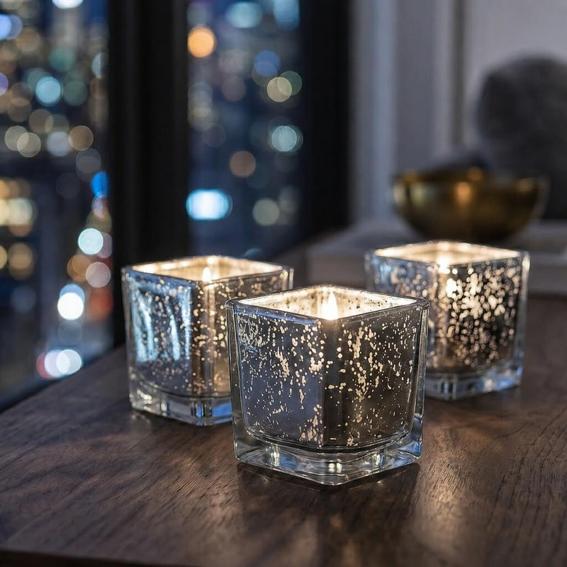 Set of glowing silver mercury square votive holders on a wooden table at night - thumbnail number 7