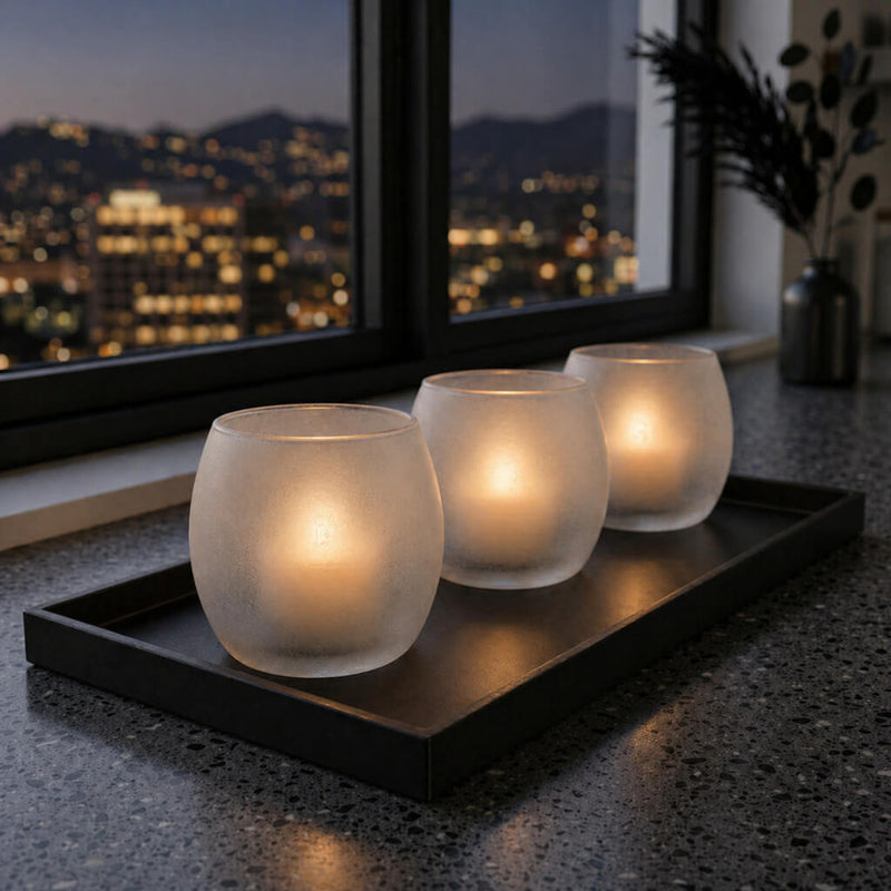 Three frosted glass candle holders on a black tray against a nighttime city skyline backdrop - thumbnail number 7