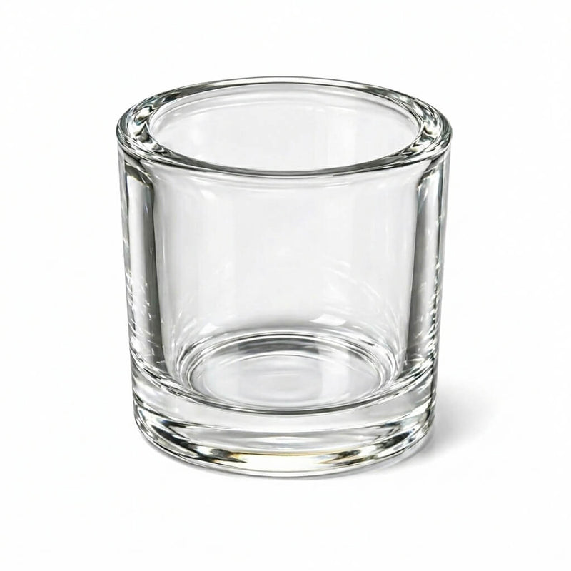 Clear glass cylindrical candle holder with thick base on white background - thumbnail number 1