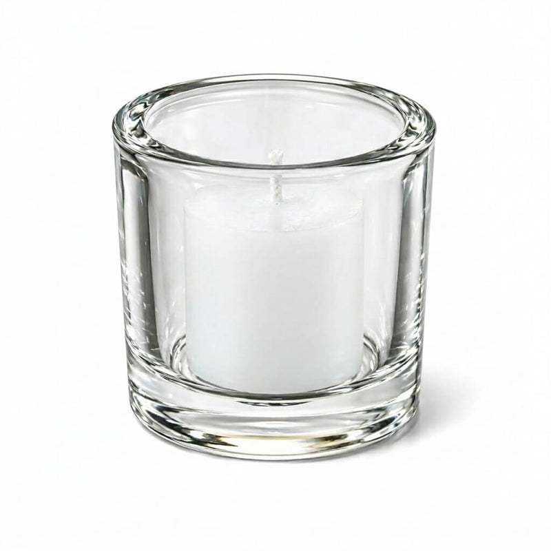 Clear glass candle holder with white votive candle on white background - thumbnail number 4