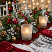 Christmas centerpiece with frosted candle holders and evergreen garland on holiday table - thumbnail number 6