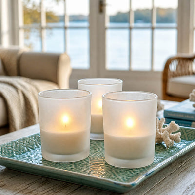 Three lit frosted candle holders on decorative tray by waterfront view - thumbnail number 8