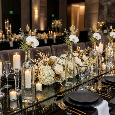 Glass square bottles with white florals on a luxury tablescape - thumbnail number 5