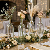 Glass square bottles with floral arrangements on a wedding tablescape - thumbnail number 3
