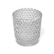 An empty clear hobnail glass votive holder isolated on a solid white background - thumbnail number 1