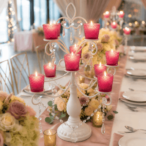 Pink hobnail votive holders on elegant white candelabra wedding centerpiece