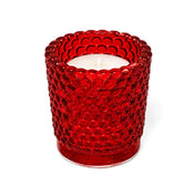 Red hobnail glass votive holder with white candle on white background - thumbnail number 2