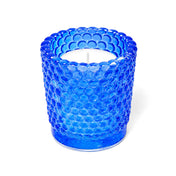 Blue hobnail glass votive candle holder with white candle on white background - thumbnail number 2