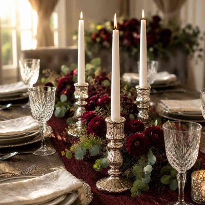Candlelit dining table with white candles and burgundy flower garland - thumbnail number 3