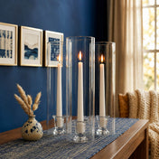 Cozy interior with white candles in tall glass cylinder vases - thumbnail number 7