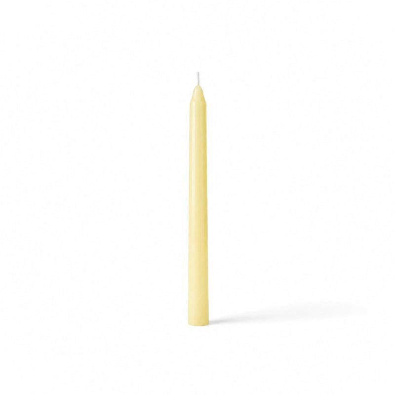 Ivory taper candle isolated on white background - thumbnail number 1