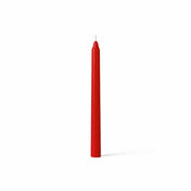 Unlit red taper candle standing on white background - thumbnail number 1