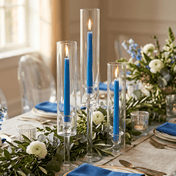 Elegant table setting with blue candles and white floral arrangements - thumbnail number 3