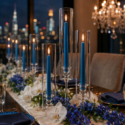Blue taper candles with floral centerpiece and city view backdrop - thumbnail number 4