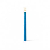 Lit blue taper candle isolated on white background - thumbnail number 2