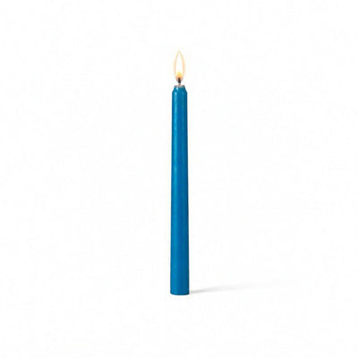Lit blue taper candle isolated on white background - thumbnail number 2