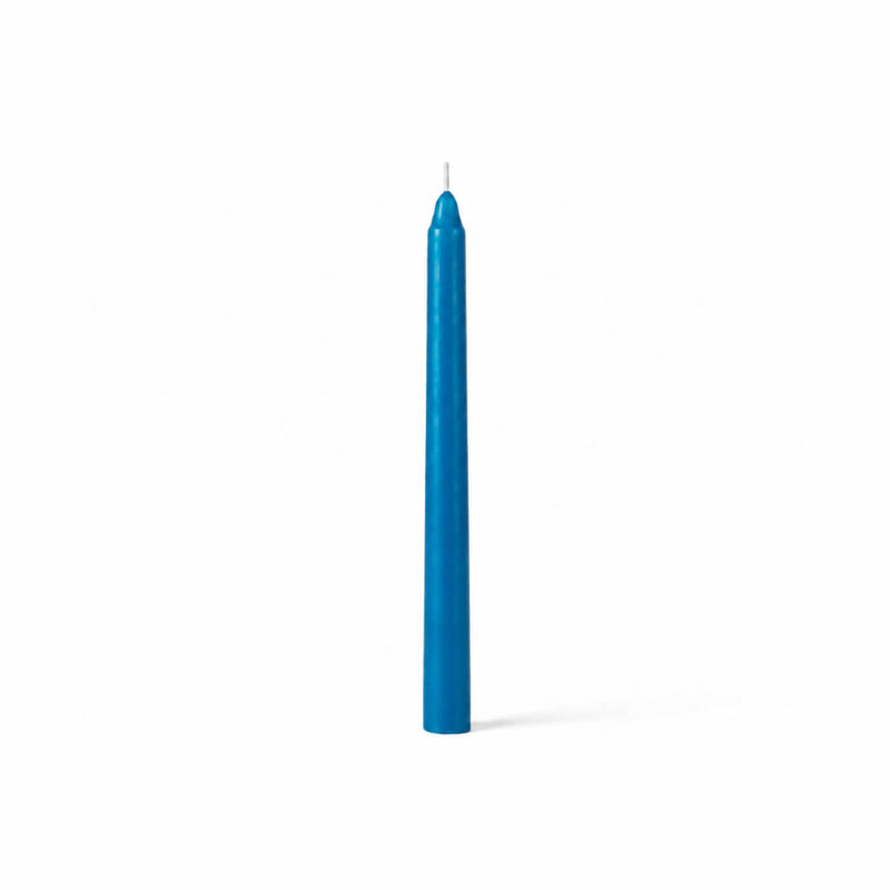 Unlit blue taper candle standing on white background - thumbnail number 1