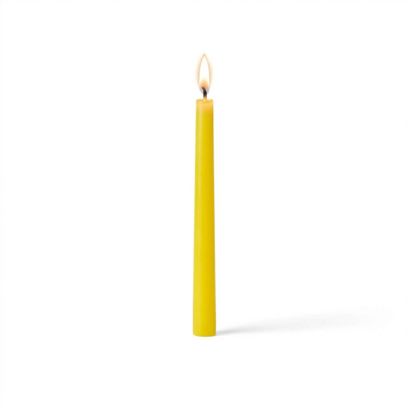 Single glowing yellow taper candle on white surface - thumbnail number 2