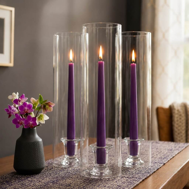 Lit purple taper candles inside tall clear glass candle holders - thumbnail number 7