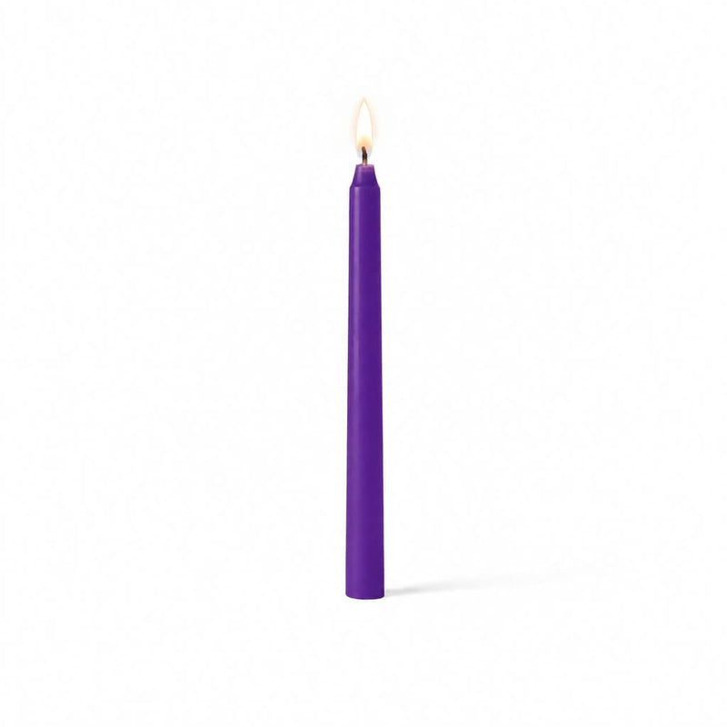 Purple lit taper candle standing on white background - thumbnail number 2