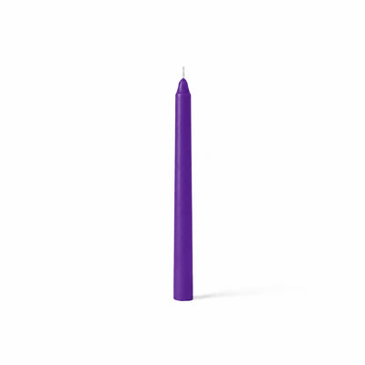 Single purple taper candle on white backdrop - thumbnail number 1