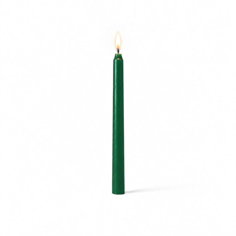 Green taper candle glowing on clean white background - thumbnail number 2