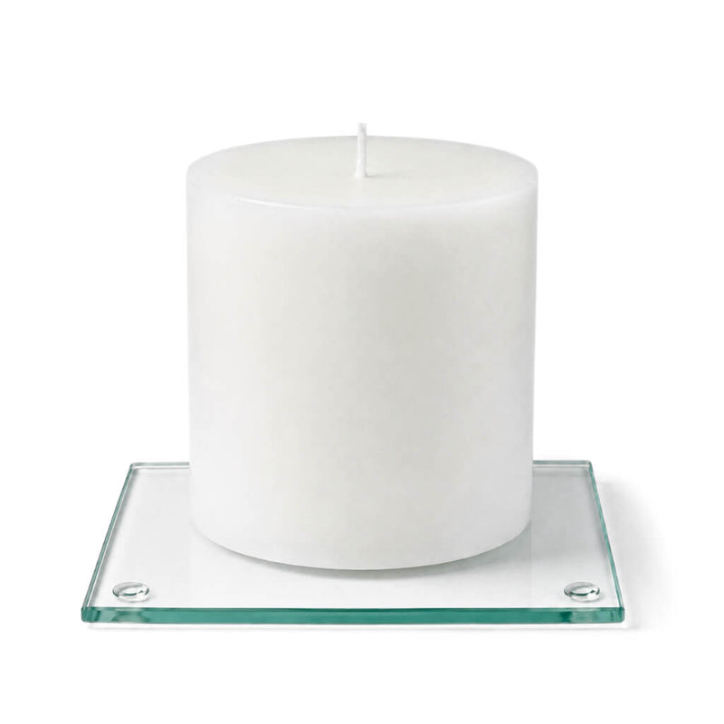 An unlit white pillar candle centered on a clear glass Square Coaster 4" on white background - thumbnail number 4