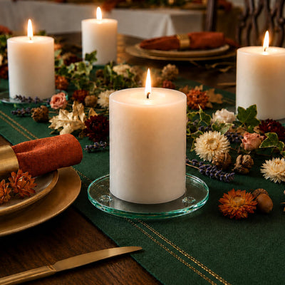 Lit white pillars on a Round Coaster 4" arrangement along a green and rust autumn table - thumbnail number 7