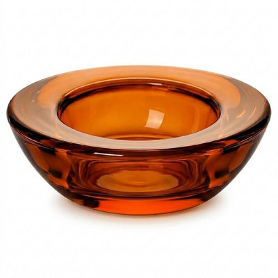 A single round amber glass tealight candle holder isolated on a white background - thumbnail number 1