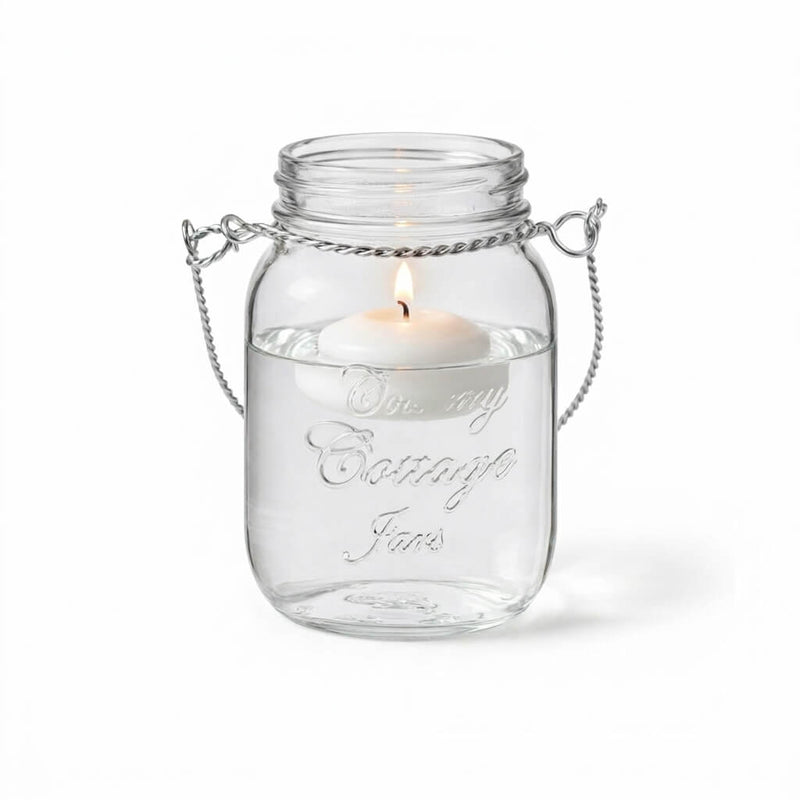 Uncluttered Small Mason Jar with Handle and lit floating candle - thumbnail number 3
