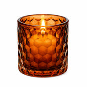 Amber honeycomb glass votive and tealight holder with lit candle on white background - thumbnail number 5