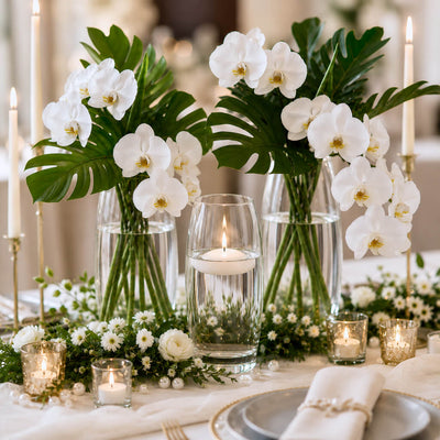 Glass vases with white orchids and leaves, and a floating candle - thumbnail number 7