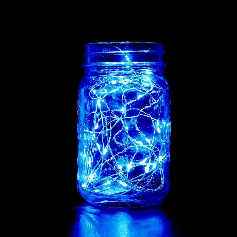 Blue fairy lights in a glass jar, glowing against a dark backdrop. - thumbnail number 1