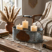 Weathered metal gray caddy holding three lit pillar candles on a rustic table - thumbnail number 6