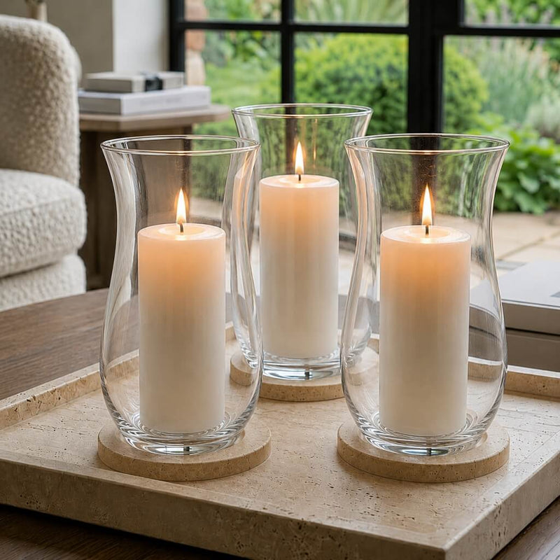 A clean and intentional living room display featuring a trio of clear 10.5 Hurricane Vases - thumbnail number 7
