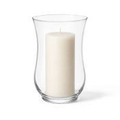 A classic clear glass 10.5 Hurricane Vase featuring an unlit candle on a plain background - thumbnail number 2