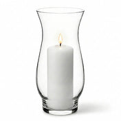 White pillar candle lit inside a clear glass 8.5" hana vase on a white background - thumbnail number 3